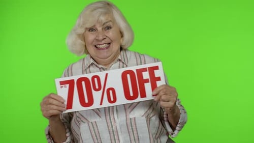 Senior Grandmother Showing Up To 70 Percent Off Inscription Sign, Rejoicing Discounts, Chroma Key