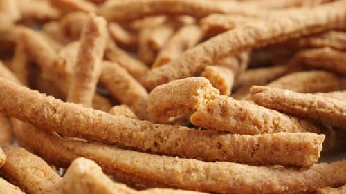 Integral breadsticks fried in oil slow tilt 4K 2160p 30fps UltraHD footage - Close-up grissini sna