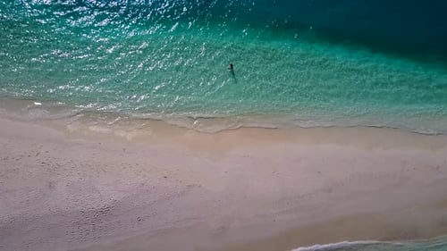 Aerial drone texture of bay beach trip by clear water with sand background