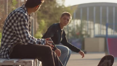 Slowmo of Teenagers in Skatepark
