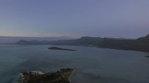 Aerial panoramic view of ocean and Mauritius coastline with mountains