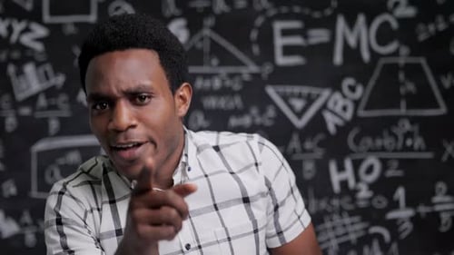 Close-up angry African American teacher talk in front of camera
