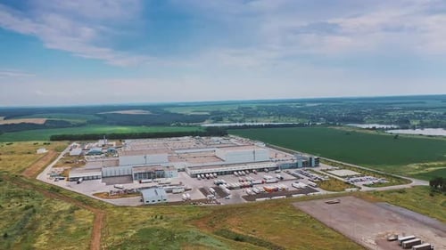 Aerial footage of a large industrial complex. Modern Factory Exterior.