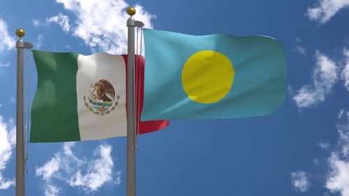 Mexico and Palau National Flags Waving Against Blue Sky
