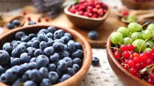 Fresh Berries in Wooden Bowls Close-Up