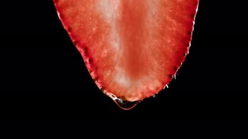 Succulent Strawberry Slice Dripping with Sugary Liquid
