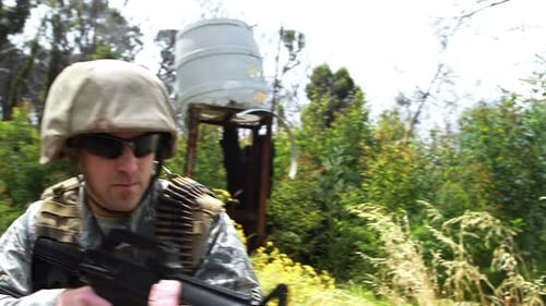 Soldier Walks in Rural Camouflage with Gun