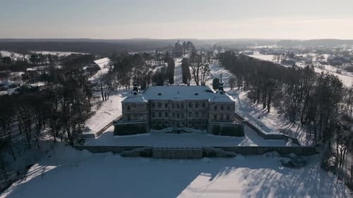 Aerial View Drone Flight Forward Over the Historic Old Castle at Sunny Winter Day Pidhirtsi Palace