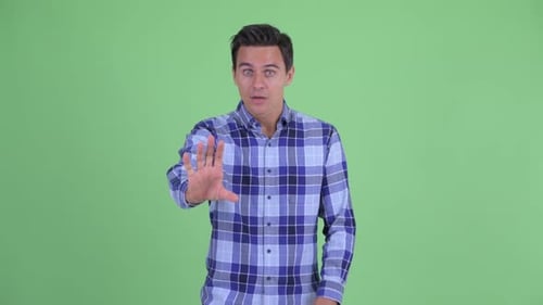 Young Adult Making Stop Hand Gesture