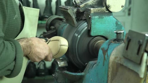 Shoemaker Smoothing Shoe Bottom With Machine