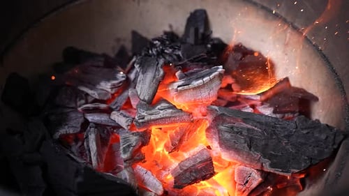 Burning Charcoal Embers in Grill Close Up