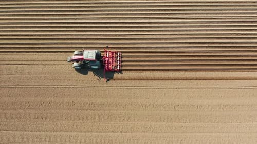 Tractor Tilling Field From Above