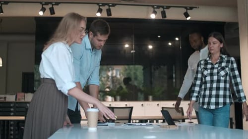 Business Team Discussing Work at White Table