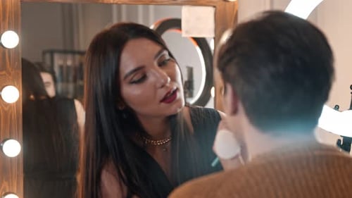 Make Up Artist Doing a Brown Bold Lips on Her Male Model - Applying Lipstick with a Brush - Talking
