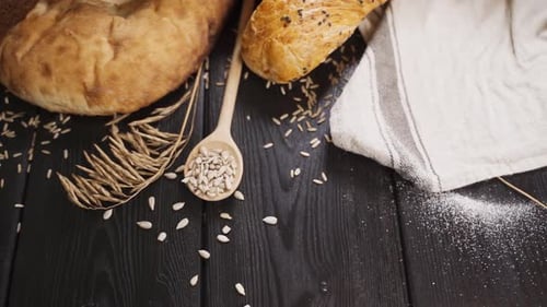 Fresh Baked Bread on Dark Wood Table