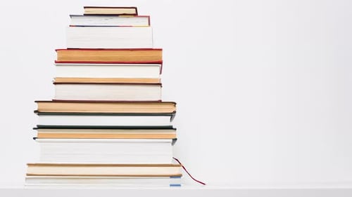 Stop Motion Animation of Growing and Shrinking Stack of Books Isolated on White Background