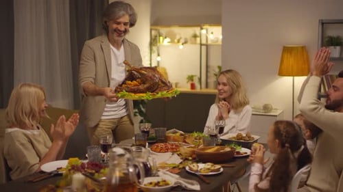 Middle-Aged Man Bringing Roasted Turkey