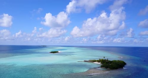 Beautiful drone island view of a summer white paradise sand beach and blue water background in 4K