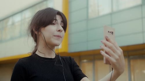 Woman Video Calling Outdoors with Smartphone