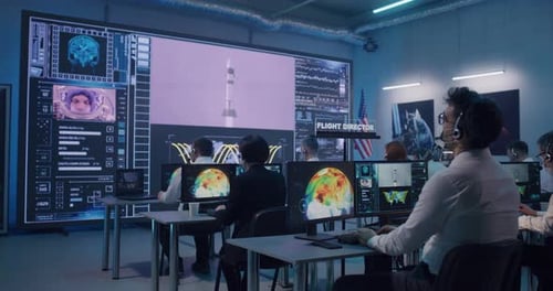 Team Watching Rocket Launch in Office