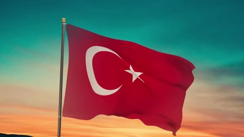 Realistic Turkish Flag Waving Against a Sunset Sky