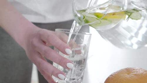 Infused Water Poured Into Glass Indoors