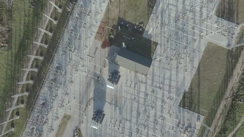 Drone Flying Directly Above Electric Substation