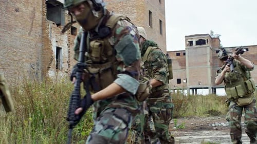 Sniper Team Running through Destroyed Area