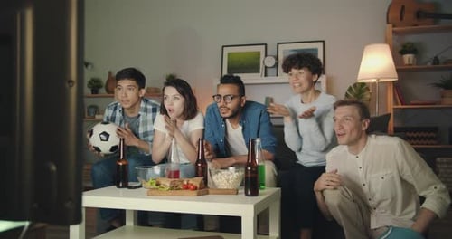 Friends Cheering and Celebrating During a Soccer Game