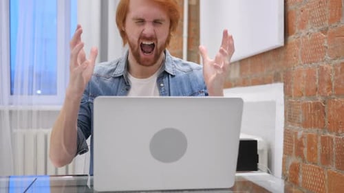 Angry Man Shouts at Laptop Computer