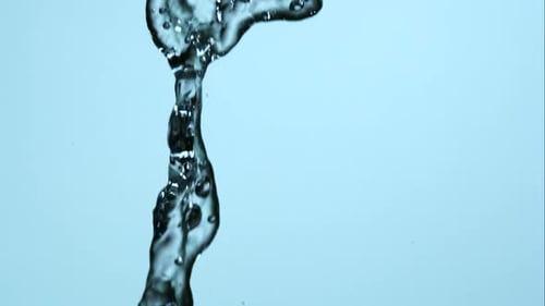 Elegant Water Stream Flowing Downwards in a Close-Up