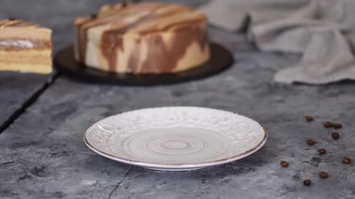 A Slice of Cake Being Cut and Served