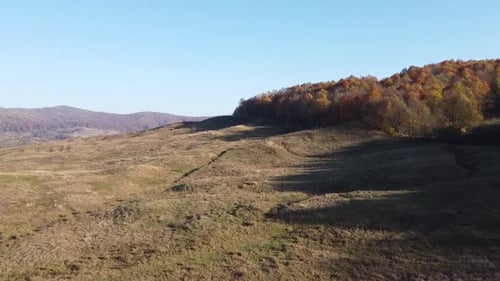Aerial view of hills on autumn season. Fall colors of a forest in Autumn Season