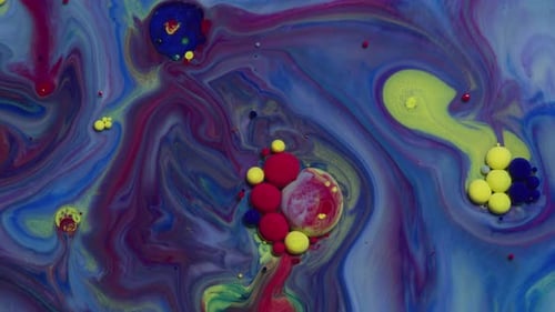 Abstract close up texture of oil with blue, red and yellow paint