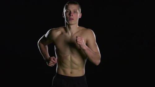 Shirtless Muscular Man Jogging in Place