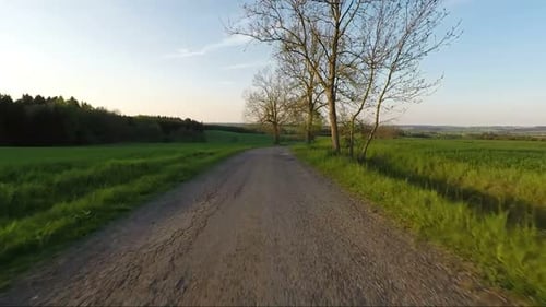 Car driving in spring rural countryside