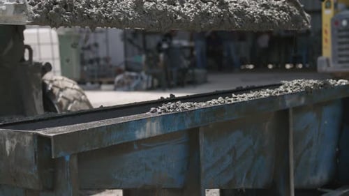 Cement Mixer Filling Container at Construction Site
