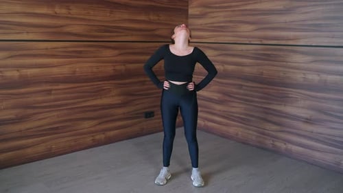 Exercise for Cervical Spine Woman is Rotating Neck Warming Muscles Before Training