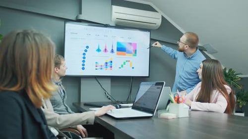 Data Presentation by Professional Team in Modern Office
