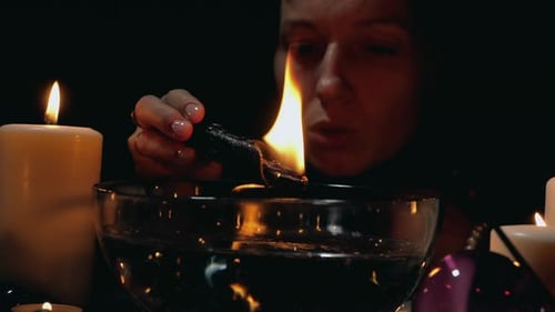 Mysterious Woman Burns Herbs Over Water Bowl