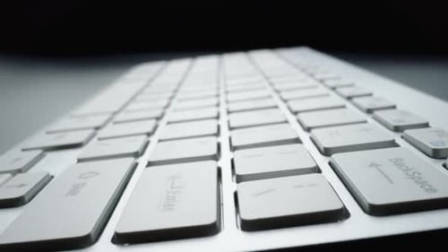 Close-up view of computer keyboard. Macro soft focus dolly shot
