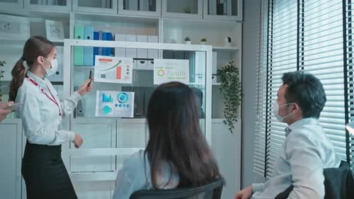 Group of Asian businessman and woman people wear mask, plan and discuss project as team in office.