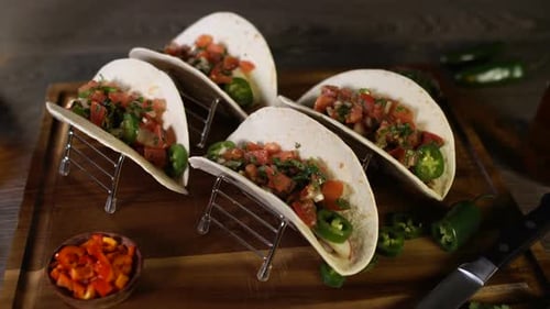 Delicious Tacos with Spicy Toppings on Display