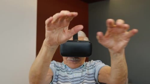 Senior Man Experiencing Virtual Reality Headset