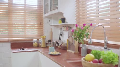 Bright Kitchen Interior with Fresh Food and Flowers