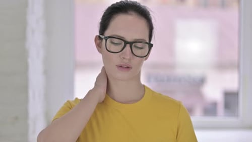 Woman Massaging Neck in Pain, Close Up