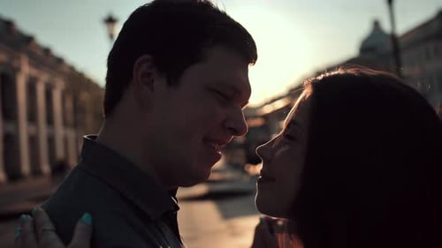 Romantic Couple Embracing at Sunset in City