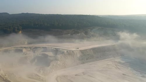 Aerial View of Open Pit Mining of Limestone Materials for Construction Industry with Excavators and