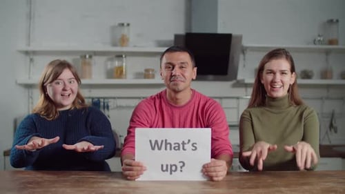 Adults Displaying Signs and Gesturing in Kitchen