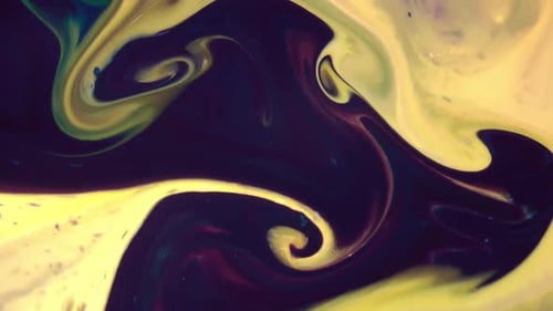 Abstract Footage of Yellow and Blue Liquids Swirling